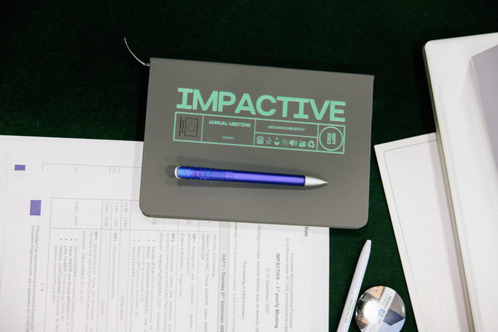 A notebook and a pen as part of the merchandising at IMPACTIVE first yearly Meeting held in Lisbon last year